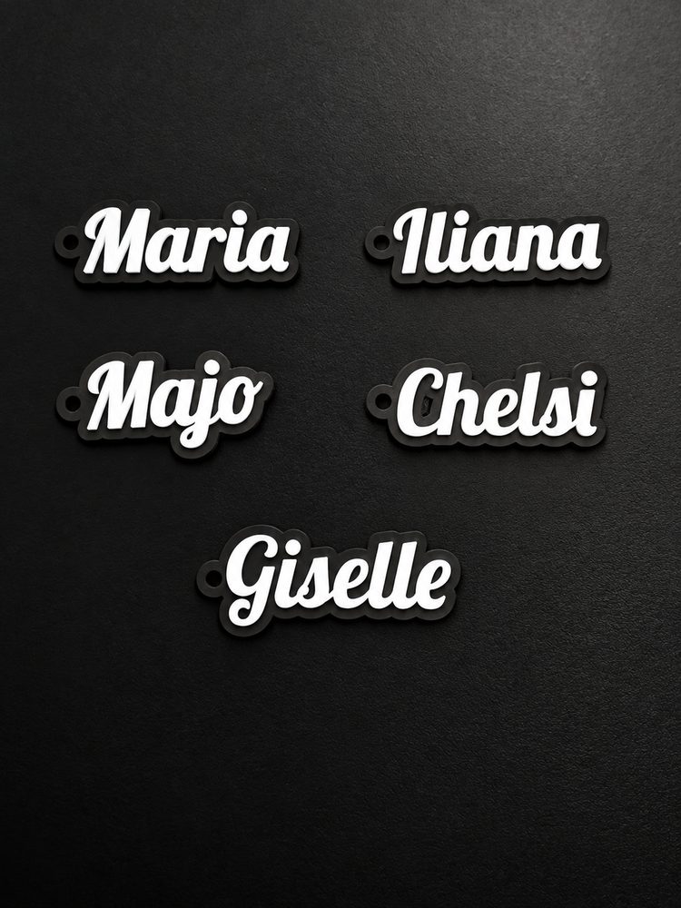 Custom name keychains in white script letters on black